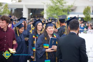 Graduates in their cap and gown at commencement.