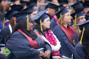 Graduates in their cap and gown at commencement.