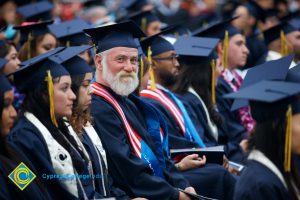 Graduates in their cap and gown at commencement.