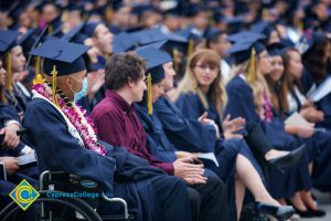 Graduates in their cap and gown at commencement.