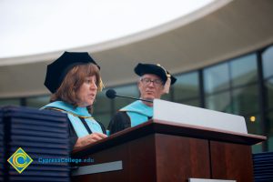 Dr. Barbara Dunsheath speaks at the 48th Commencement as President Bob Simpson looks on.