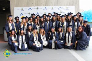 A large group of EOPS students in their cap and gown.