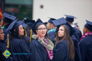 Graduates in their cap and gown at commencement.