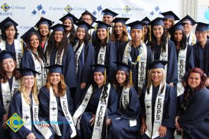 A large group of EOPS students in their cap and gown.