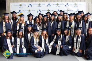 A large group of EOPS students in their cap and gown.