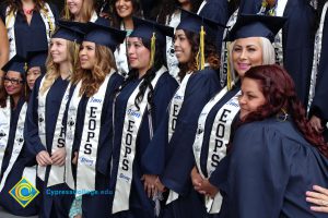 A large group of EOPS students in their cap and gown.