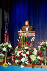 Howard Kummerman speaking at the podium.