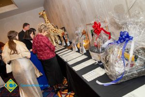 People looking at silent auction items.