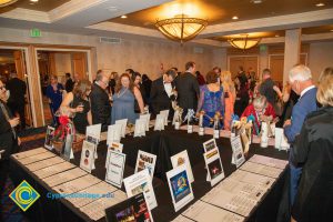 People looking at the silent auction items.