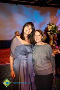 Two women smiling.