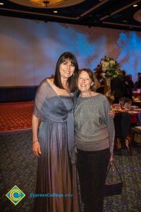 Two women smiling.