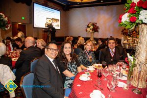 Two women and two men seated at the dining table at the 44th Annual Americana Awards.