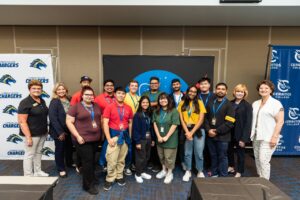 Cypress College participants in a NASA robotics competition pose for a group photo.