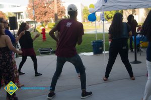 Students dancing near pond