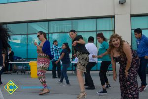 Students and employees dancing near Student Center