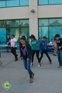 Students and employees dancing near Student Center