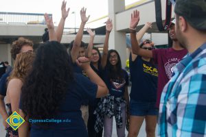 Students in a circle doing a huddle break