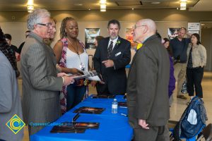 Bob Simpson, student, and Cliff Lester talking to male Holocaust survivor