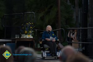 Holocaust Survivor Gerda Seifer in wheelchair giving speech at Yom HaShoah