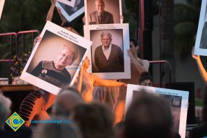 Dancers performing with pictures of Holocaust survivors