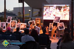 Dancers performing with photos of Holocaust survivors