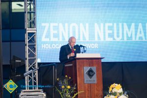 Holocaust survivor Zenon Neumark speaking at the podium