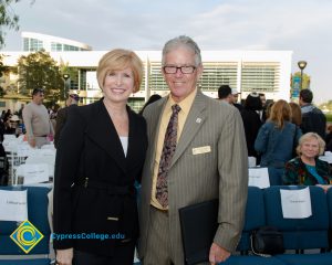 Then-president Dr. Bob Simpson standing with President JoAnna Schilling, Ph.D.