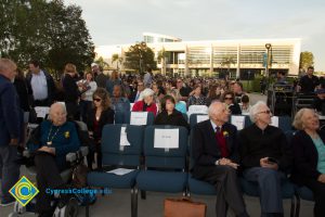 Holocaust survivors seated, waiting for event to begin