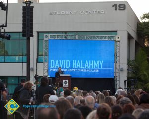 Professor David Halahmy speaking at podium