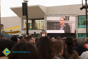 Professor David Halahmy speaking at podium