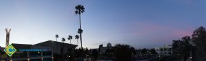 Panorama of campus with pond and campanile