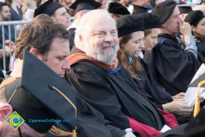 Faculty sit in audience at commencement