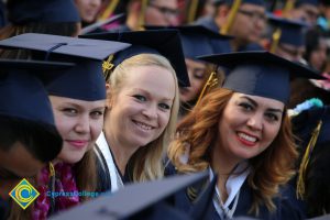 Graduates in regalia at commencement ceremony