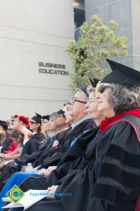 Faculty sit at commencement