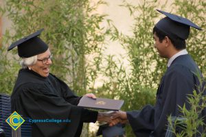 Student receives degree at commencement ceremony