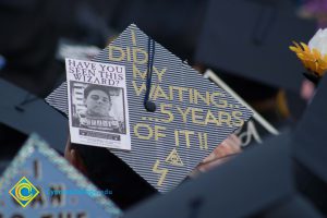 "I did my waiting... 5 years of it!" written on a graduation cap