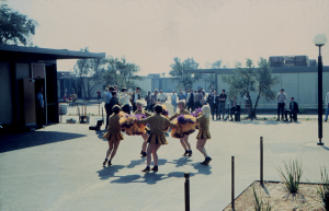 Cypress College cheerleaders dancing around at the first ever opening day ceremony in 1966.