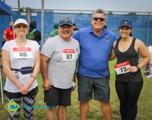 Participants of veterans 5k wearing athletic gear and race numbers