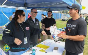 Veterans 5k race participant picking up race packet at table