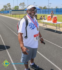 David Booze wearing Dodgers jersey and race medal