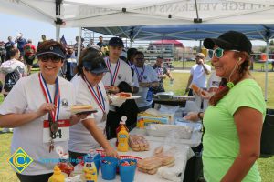 Veterans 5k participants eating hot dogs