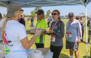 Dr. Simpson and his wife getting food at veterans 5k