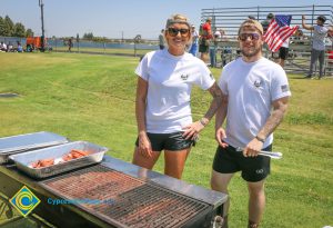 Man and woman serving food and veterans 5k