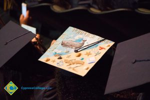 A graduation cap reads "I found my porpoise at CSUF"
