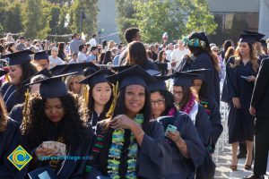 Students smile at commencement