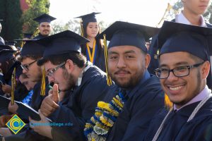 Students smile at commencement