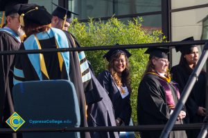 Faculty and staff onstage at commencement