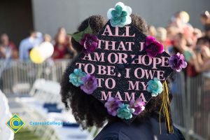 A graduation cap reads "All that I am or hope to be, I owe to my mama"