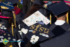 Graduation caps read "RN" and "SFSU"