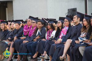 Students sit in the audience at commencement